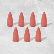 A pack of specialized backflow incense cones, essential for creating the smoke waterfall effect.