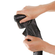 A hand holding a tied black dustbin bag, ready for hygienic and contained waste disposal.