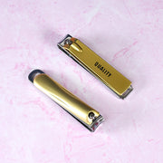 Lifestyle shot of the portable nail clippers on a travel essentials tray, ready for use.