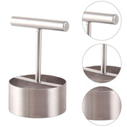 Fruit corer lying on a kitchen counter, highlighting its sleek design.