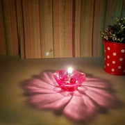 Packaging for the 12-piece multicolor plastic Diwali Diya Set.