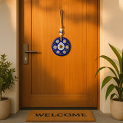 Evil Eye Wall Hanging with ruler for size reference illustrating compact dimensions