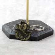 Side view of Ganesh Face Antique Black Metal Keychain displaying metal craftsmanship