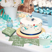 Mint green disposable paper napkins with decorative scalloped edges for baby shower