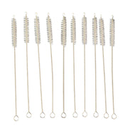 Nylon bristles cleaning a reusable metal straw with the brush from the set