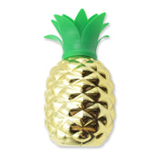 Pineapple cup with straw as part of a festive tropical party table setting.
