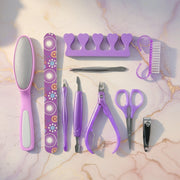 Stainless steel manicure and pedicure tools arranged neatly in the grooming set