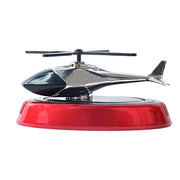 Solar helicopter air freshener positioned inside car interior