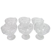 Variety of desserts like parfaits and sundaes beautifully presented in glass serving cups.