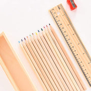 The wooden ruler and the colorful pencil box, essential accessories from the art kit.
