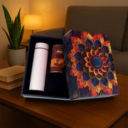 Luxury designer golden gift box containing coffee almonds and bottle