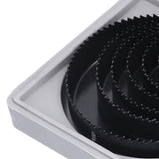Multiple carbon steel hole saws of different diameters, highlighting the range available in the kit.