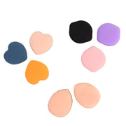 Mini finger powder puff demonstrating easy grip for makeup use