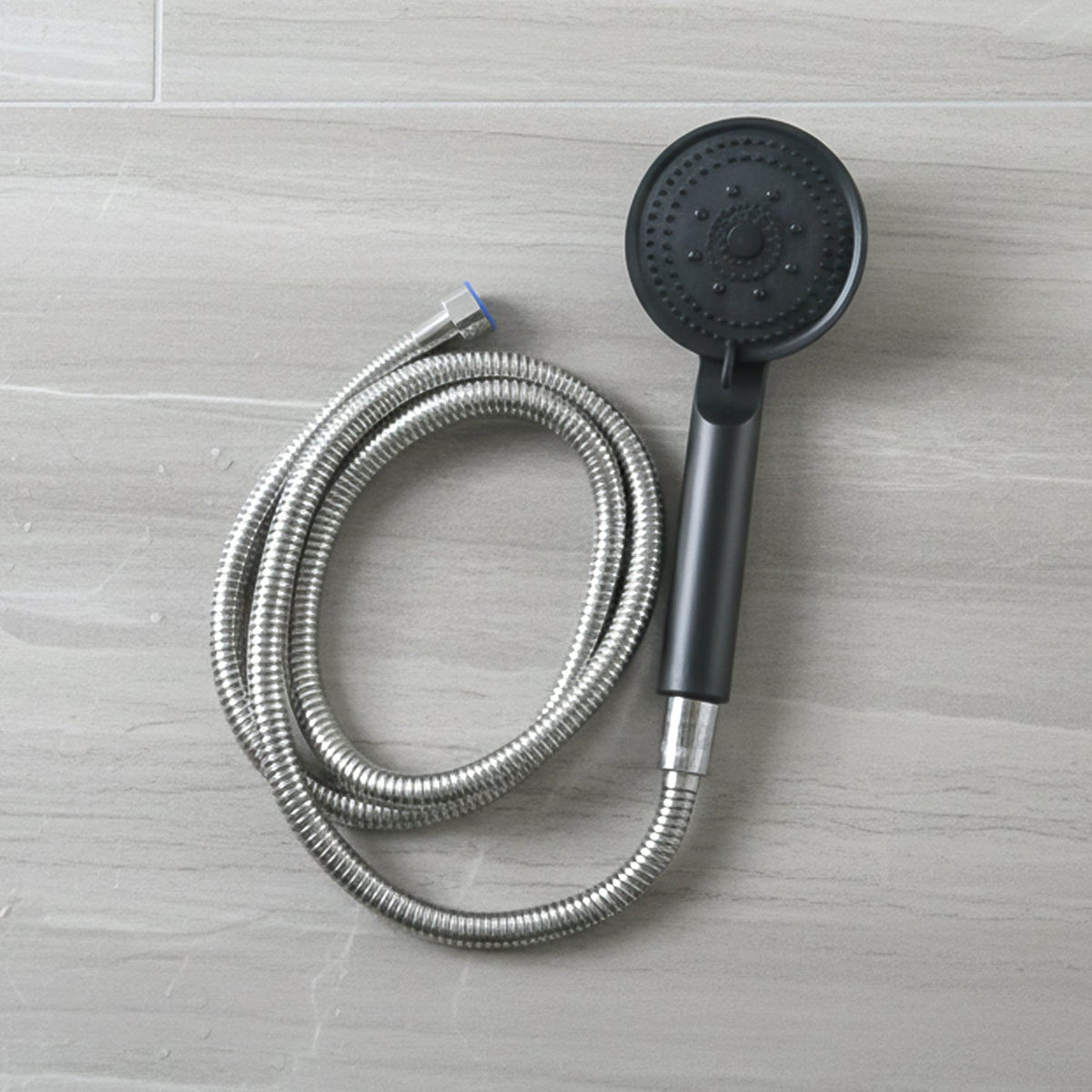 Flexible stainless steel hose connected to shower handle shower head
