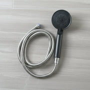 Flexible stainless steel hose connected to shower handle shower head