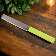 Top view of vegetable peeler and grater from kitchen cutting set