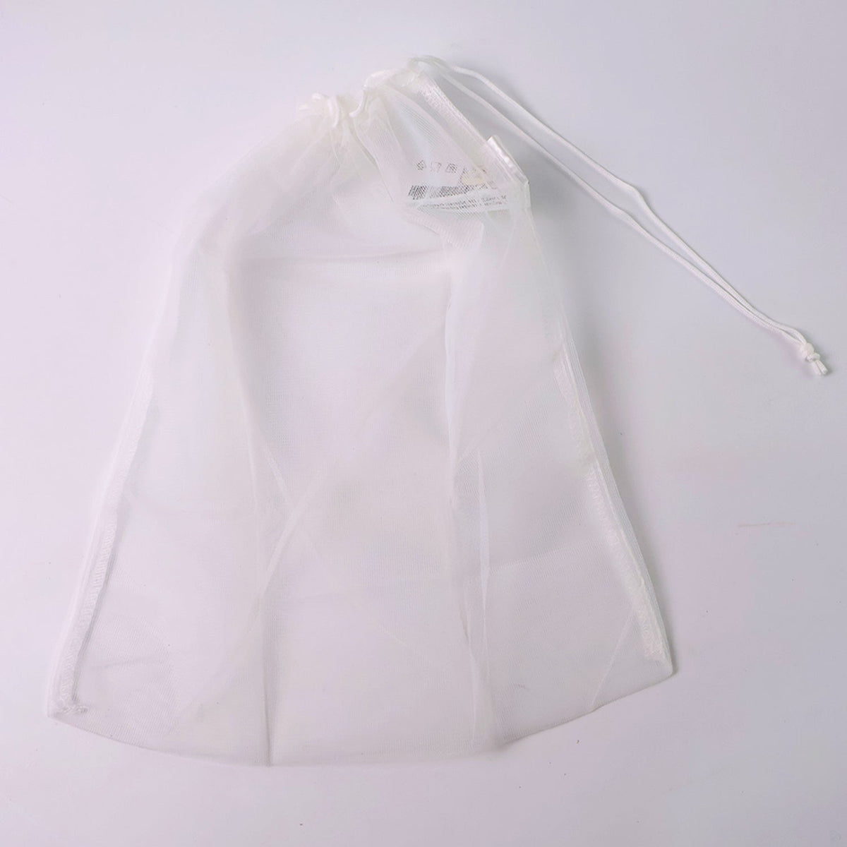 Reusable mesh storage bag showing detailed drawstring mechanism