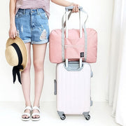 Compact Foldable Travel Bag neatly folded for easy storage or transport.