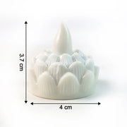 Decorative lotus designed LED tealight candles glowing warmly in dark