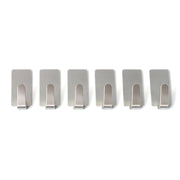 Wall hooks hanging keys and towels in home setting