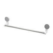 Wall-mounted adhesive towel rod holding towels in bathroom setting