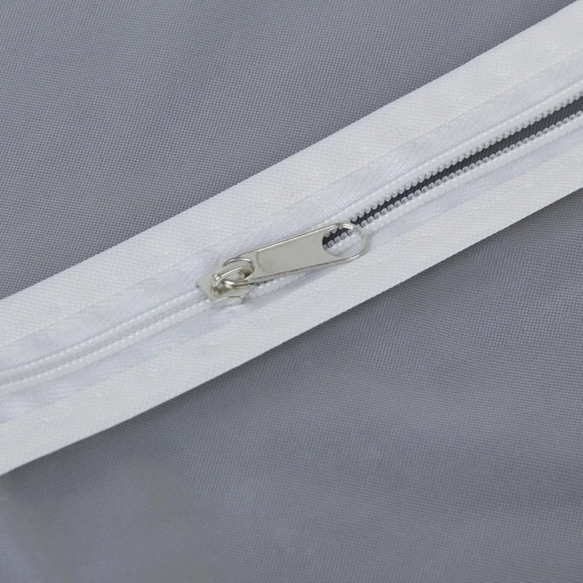 Closeup of durable full-length zipper on the breathable fabric suit cover.