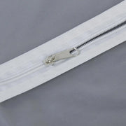 Closeup of durable full-length zipper on the breathable fabric suit cover.