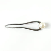 Close-up of pearl hair pin detail