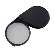 Portable magnifying glass with durable folding lens cover