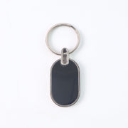 Monogram edge silver and black oval metal key holder accessory