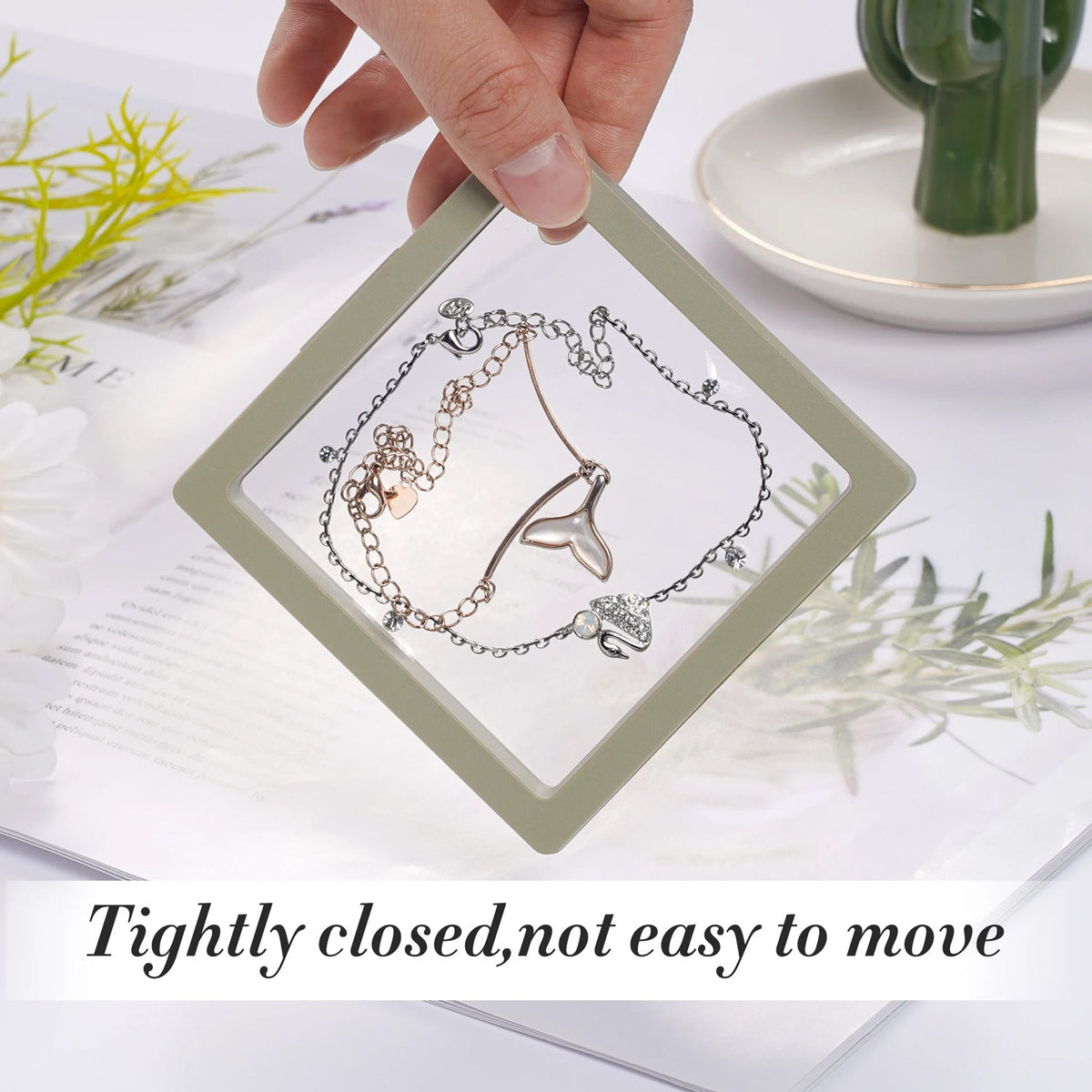 Transparent Floating Jewelry Display Box with a pearl necklace and stud earrings.