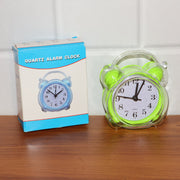 Portable compact quartz analog alarm clock in green transparent frame