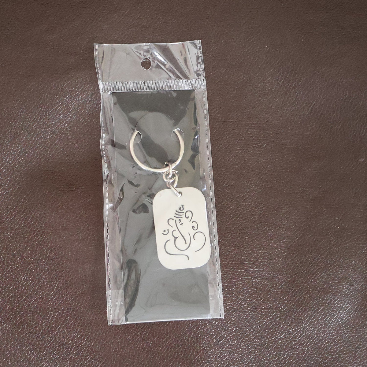 Back view of the Ganesh Metal Keychain, showing its smooth edges and premium finish.
