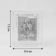 Sacred silver embossed Lord Ganesha photo frame displayed on altar