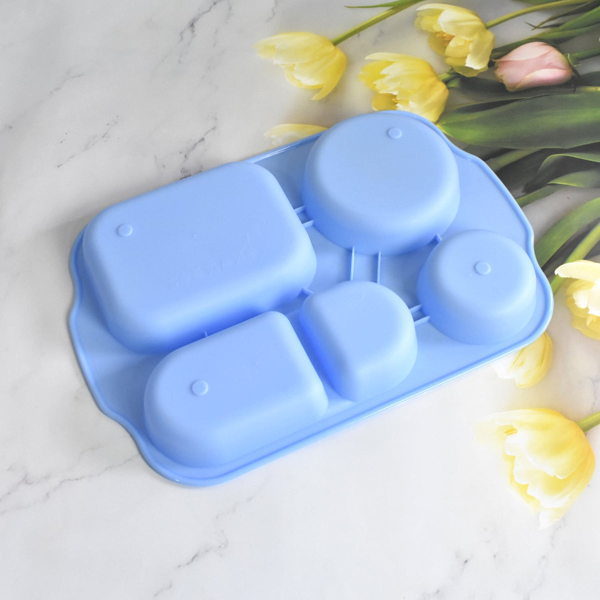 Assortment of vibrant, multicolor square 5-compartment food plates.