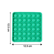 Close-up of popping bubbles on silicone Pop It toy