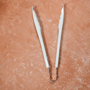 Cooking tongs featuring comfortable plastic handles for prolonged use.