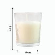 Close-up of a lit Blueberry Scented Votive Candle, showing the gentle flame.