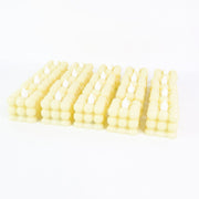 Decorative table setting illuminated by warm LED flameless cube candles