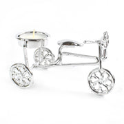 Decorative cycle tealight stand with candle enhancing living space ambiance