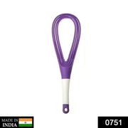Plastic whisk mixer effortlessly blending milk and coffee for a smooth drink.