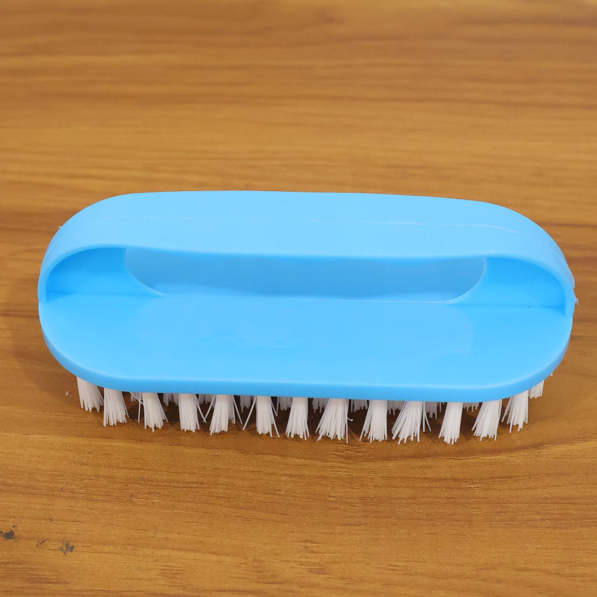 Heavy-duty scrub brush tool designed for deep cleaning stubborn dirt and stains.