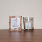 A close-up of the elegant glass jar, perfect for a reusable candle container.