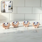 Close-up view of wall mounted broom and mop holder clip