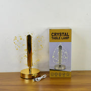 Luxury golden crystal LED table lamp illuminated in ambient setting