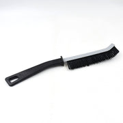 Versatile cleaning brush effectively cleaning kitchen and bathroom crevices.
