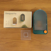 Drainage feature of wall mounted soap holder with water flow management