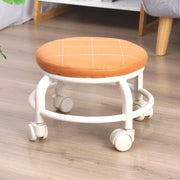 Low height rolling stool in white, designed for easy movement across floors.