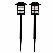 A pair of black solar garden lights with white grid panels are shown standing upright against a plain white background.