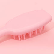 Silicone scalp scrubber shampoo brush showing gentle bristles